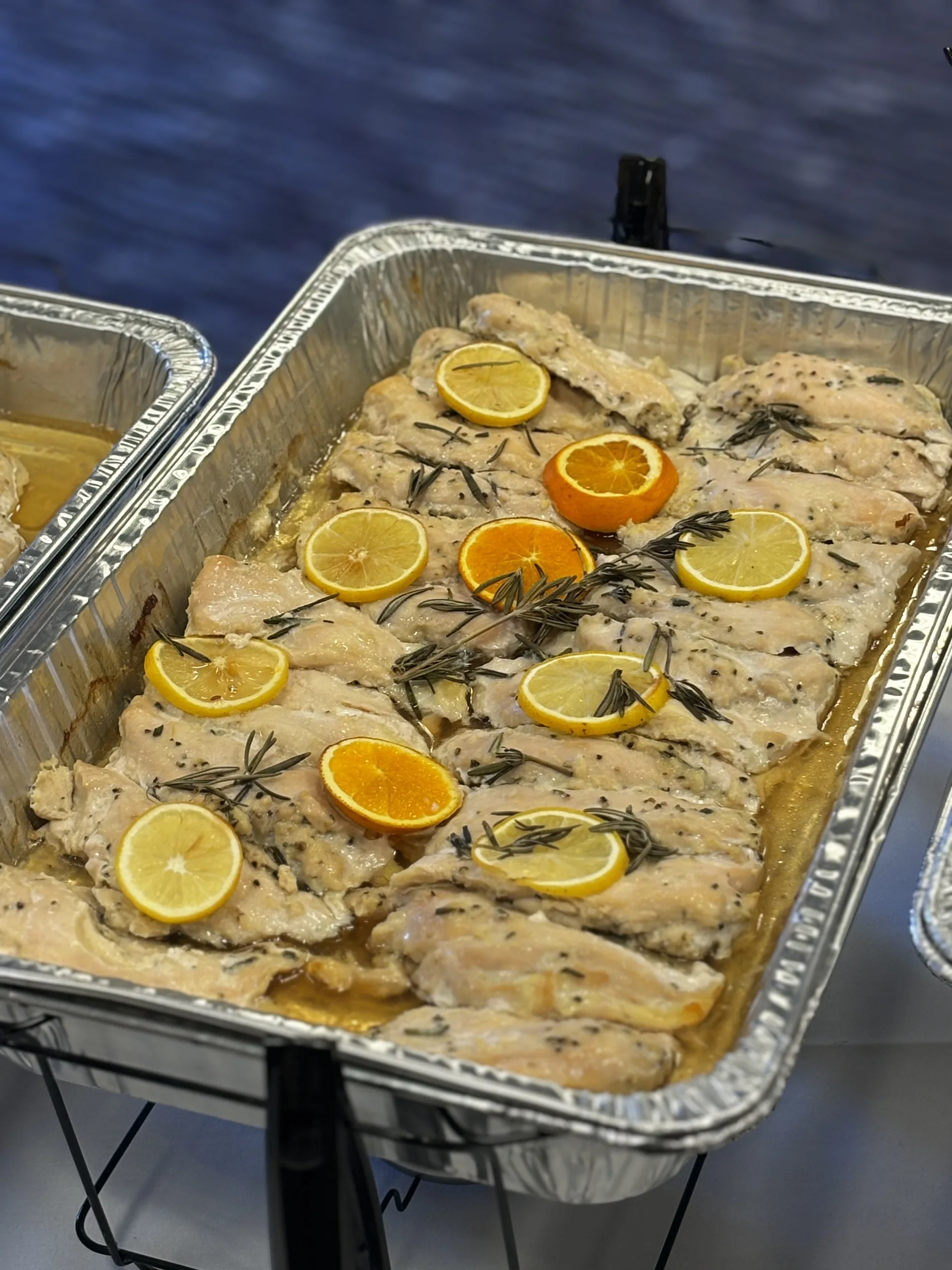 Fresh NOM Catering meals boxed and ready for delivery