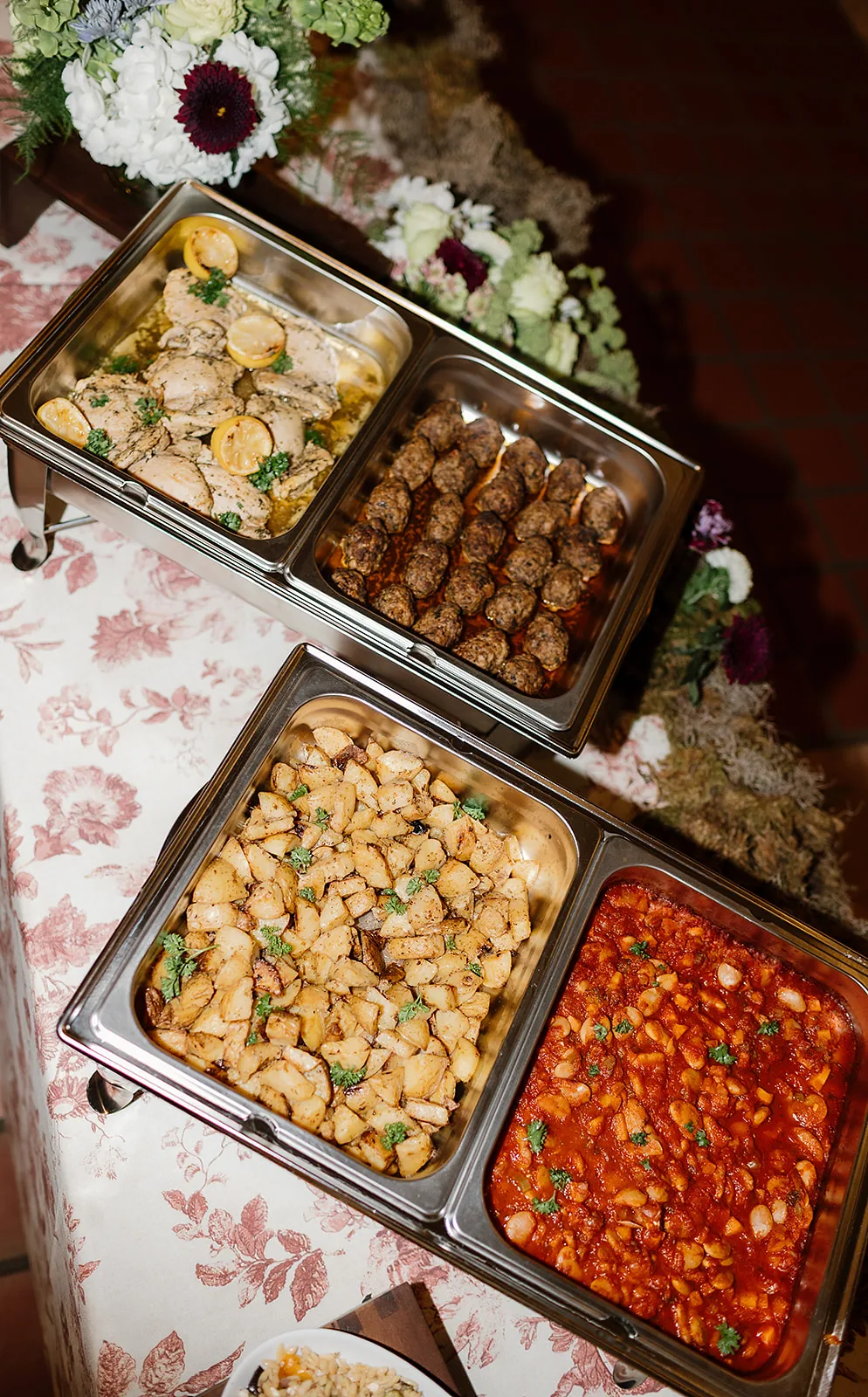 Plated dinner service at an elegant NOM Catering event